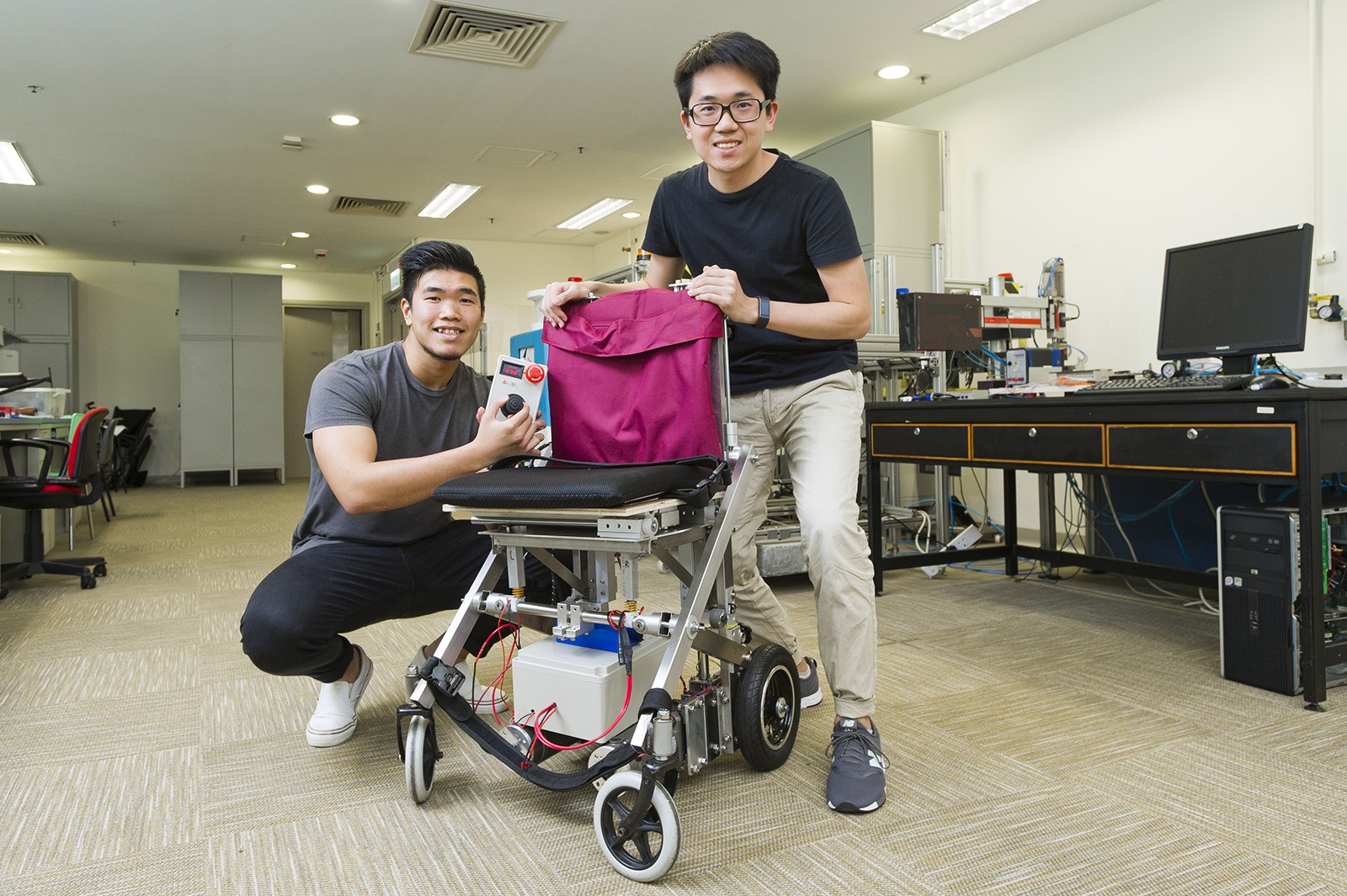 Transformable wheelchair developed by Chan Tsz-lung (left) and his teammate Lam Wah-shing.