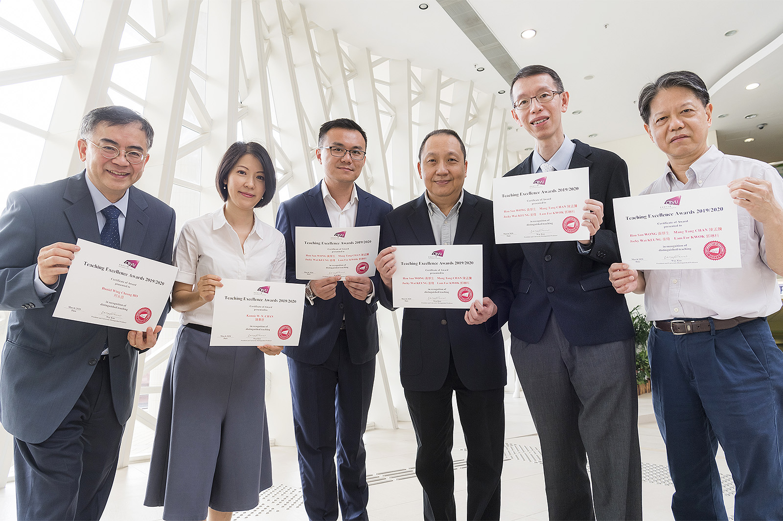 TEA winners at CityU (from left): Professor Daniel Ho Wing-cheong, Dr Kannie Chan Wai-yan, and the IT Professional Placement Team comprising Dr Jacky Keung Wai, Dr Chan Mang-tang, Dr Raymond Wong Hau-san and Dr Kwok Lam-for.