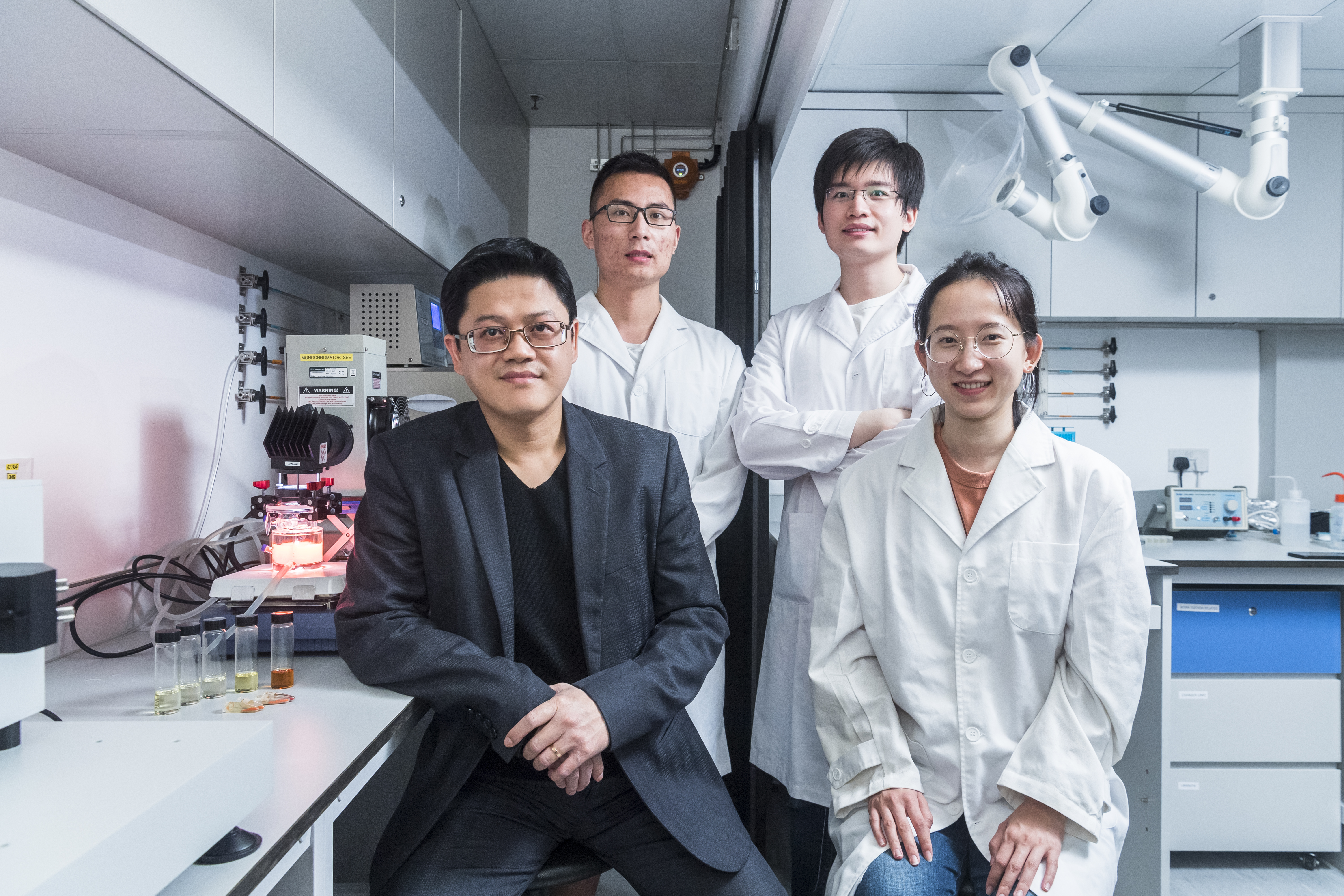 Dr. Sam Hsu (left, front) and his team: Tang Yunqi (right, front), Peng Yong (left, back), and Stanley Mak (right, back). 