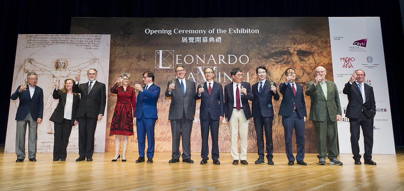 guests raise a toast at the opening ceremony.